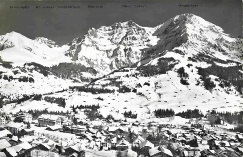 AK / Ansichtskarte Adelboden Frutigen BE Bonderspitz Kl-Lohner Bonderkrind Nuenihorn Mittel-Lohner Grosslohner Winterpanorama Schnee Dorf