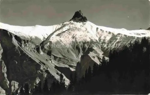AK / Ansichtskarte Adelboden Frutigen BE Tschingelochtighorn Schnee Fels Tannen Gipfel Bergmassiv