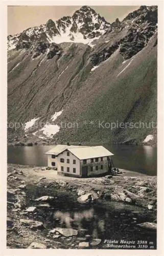 AK / Ansichtskarte Flueelapass 2383m Ospiz Fluela GR Flueela-Hospiz Schwarzhorn See Berge Felsen Hospiz