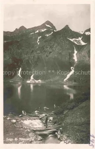 AK / Ansichtskarte Lago di Tremorgio 1851m Rodi-Fiesso Leventina TI Lago-di-Tremorgio Bergsee Alpen Schnee Felsen Wanderer