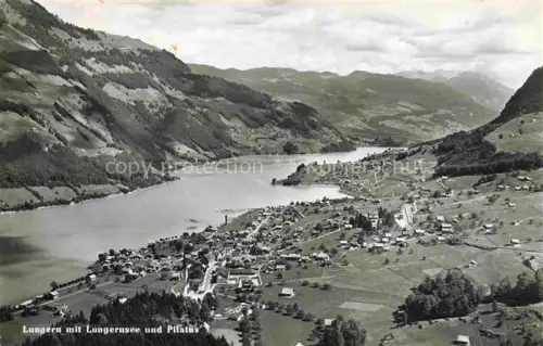 AK / Ansichtskarte Lungern Obwalden OW Lungernsee Pilatus Dorf See Talansicht Berge Fliegeraufnahme
