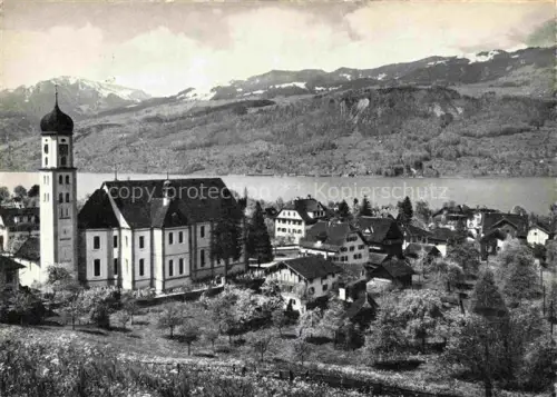 AK / Ansichtskarte Melchtal Melchthal OW Melchtal Kirche Zwiebelturm See Dorfansicht Berge Obstbaeume
