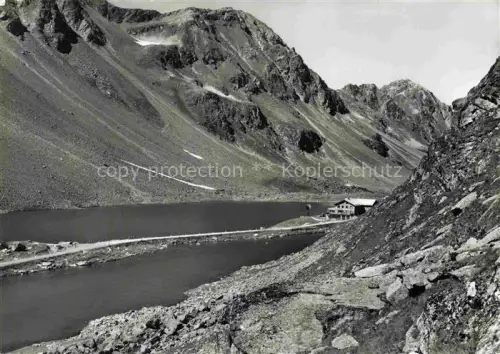 AK / Ansichtskarte Ospiz Flueela Fluela Flueelapass 2383m GR Hospiz Bergsee Flueelapass Fels Gebirge Alpensee Berghaus Hochgebirge