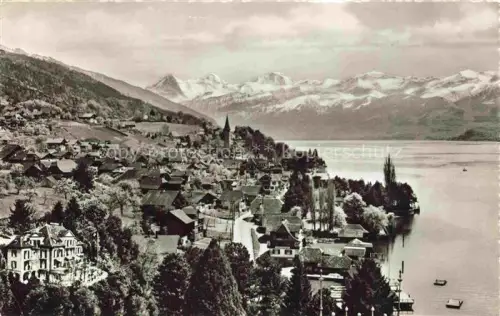 AK / Ansichtskarte Hilterfingen Thunersee BE Thunersee Eiger Moench Jungfrau Hotel-Marbach Kirche Dorf See Berge