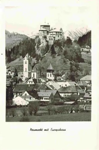 AK / Ansichtskarte Neumarkt Steiermark AT Europahaus Schloss Kirchturm Stadtpanorama Berge Haeuser