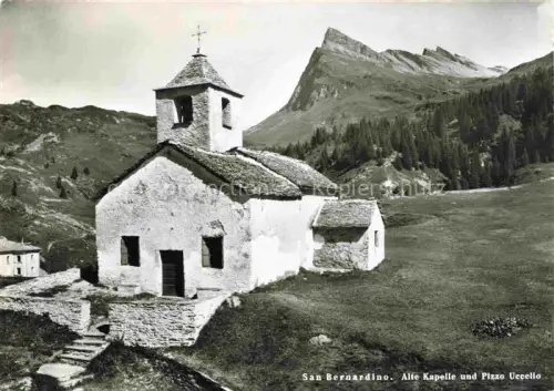 AK / Ansichtskarte San Bernardino Hinterrhein GR Alte-Kapelle Pizzo-Uccello Berglandschaft Romanische-Kapelle Bergdorf Wiese