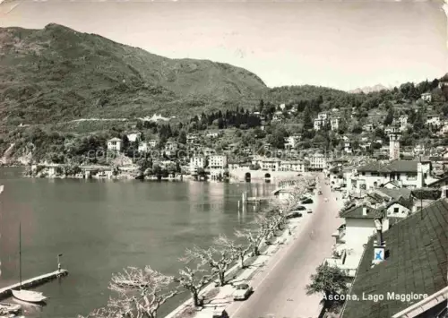 AK / Ansichtskarte Ascona Lago Maggiore TI Lago-Maggiore Seepromenade Bergpanorama Bootsanleger Kirchturm Haeuser Wald Uferstrasse