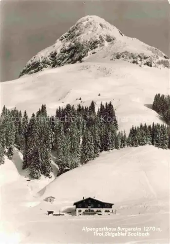 AK / Ansichtskarte Burgeralm 1270m Saalbach-Hinterglemm AT Saalbach Skigebiet Berggasthaus Winter Schnee Bergkuppe Tannen Fieberbrunn