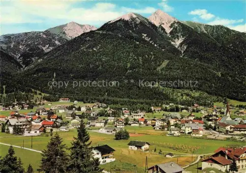 AK / Ansichtskarte SEEFELD Tirol AT Reitherspitze Hoehenluftkurort Ortsansicht Kirche Wiesen Bergwald Haeuser