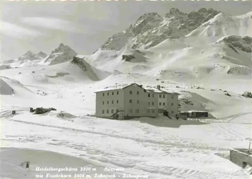 AK / Ansichtskarte Heidelbergerhuette 2265m Silvretta Tirol AT Heidelbergerhuette Silvretta Fluchthorn Zuhnjoch Zuhnspitze Schneelandschaft Gebirge Berghuette Winter