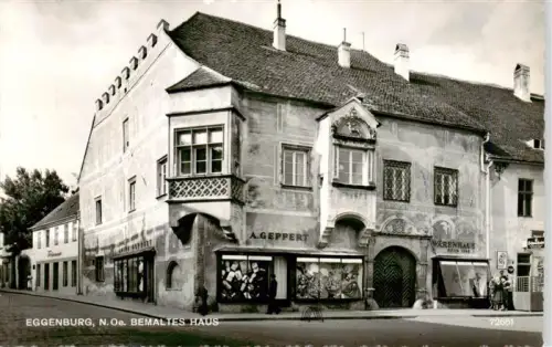 AK / Ansichtskarte Eggenburg Niederoesterreich AT Bemaltes-Haus Geppert Warenhaus Fresko Wandmalerei Altstadt Geschaefte
