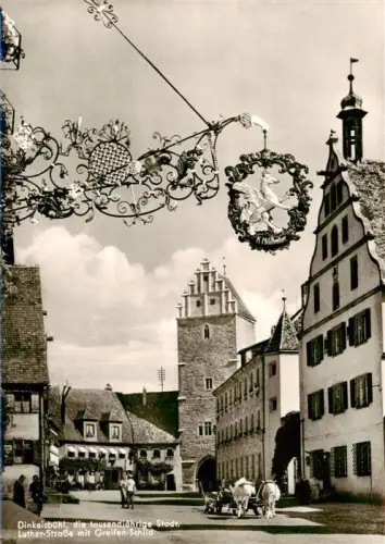 AK / Ansichtskarte DINKELSBueHL Luther-Strasse Greifen-Schild Schmiedeeisen-Ausleger Stadttor Turm Kutsche Altstadt Fachwerk