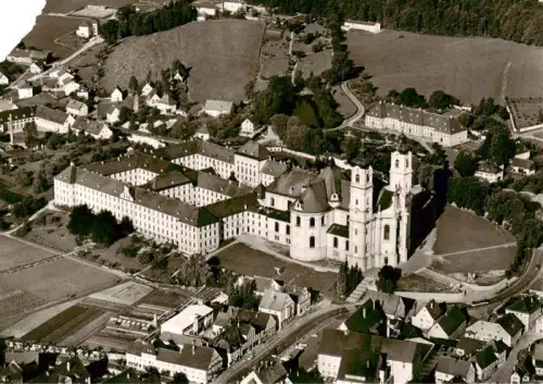 AK / Ansichtskarte Ottobeuren Bayern Benediktinerabtei Kloster Barockkirche Fliegeraufnahme Klostergebaeude Ortschaft Allgaeu