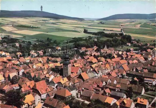AK / Ansichtskarte Flegessen Bad Muender Deister Niedersachsen Kirche Altstadt Daecher Felder Huegel Fliegeraufnahme