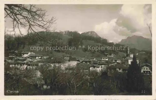 AK / Ansichtskarte Carona Lago di Lugano TI Dorfansicht Kirchturm Baeume Berge Haeuser