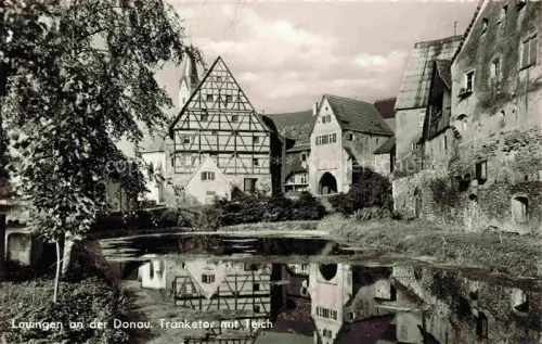 AK / Ansichtskarte Lauingen Donau Bayern Traenketor Teich Fachwerkhaus Stadtmauer Kirche Spiegelung Tor
