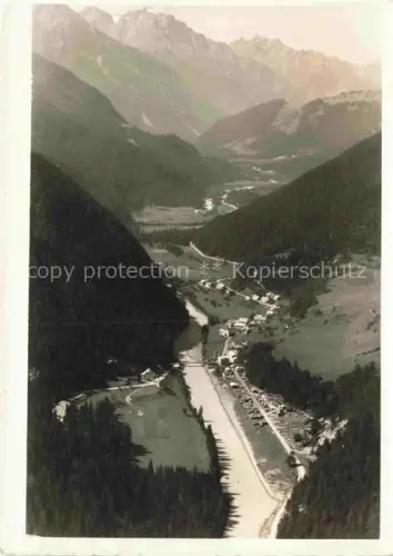 AK / Ansichtskarte Martina Inn Unterengadin GR Unter-Engadin Tal Inn Berge Wald Siedlung Fliegeraufnahme