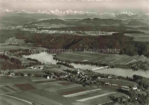 AK / Ansichtskarte Wohlen Bern BE Fliegeraufnahme Dorf Kirche Fluss Felder Wald Alpen