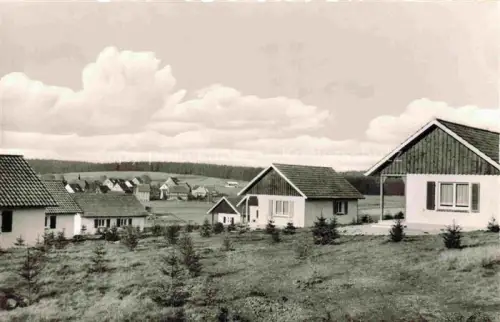 AK / Ansichtskarte Buntenbock Oberharz Goslar Niedersachsen Feriendorf-Harzerland Wohnhaeuser Oberharz Huegel Wald Neubausiedlung
