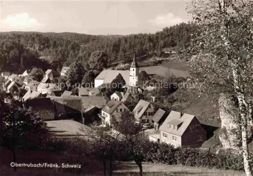 AK / Ansichtskarte Obertrubach Forchheim Bayern Kirchturm Dorf Baeume Wald Felder Haeuser Fraenkische-Schweiz