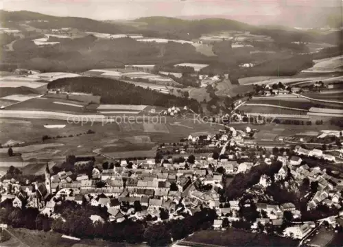 AK / Ansichtskarte Pleystein Neustadt Waldnaab Bayern Fliegeraufnahme Markt Kirche Felder Wald Huegel Oberpfalz