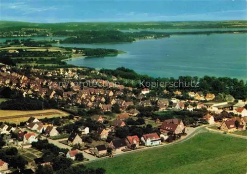 AK / Ansichtskarte Ascheberg Holstein Ploen Schleswig-Holstein Grosser-Ploener-See Luftbild Ortschaft See Ufer Baeume Haeuser