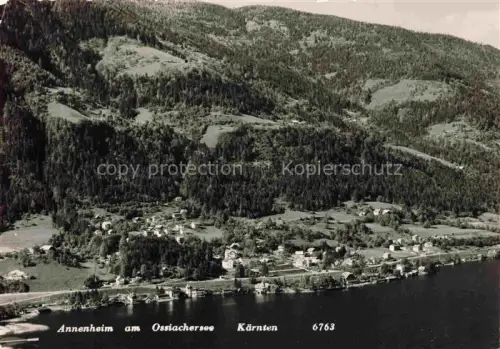 AK / Ansichtskarte Annenheim Ossiacher See Kaernten AT Ossiachersee Fliegeraufnahme See Ortschaft Wald Berge Haeuser