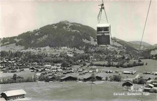 AK / Ansichtskarte Gstaad Saanen BE Gondelbahn-Eggli Dorf Seilbahn Berge Talblick Haeuser