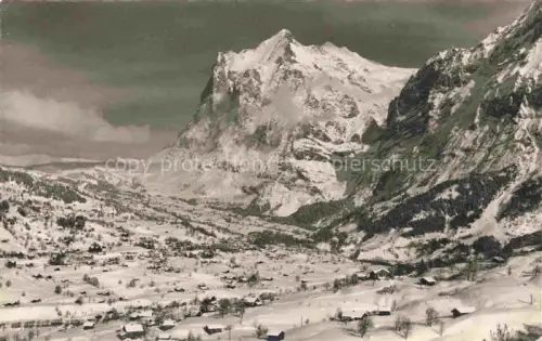 AK / Ansichtskarte Grindelwald BE Wetterhorn Schnee Winter Berge Tal Ortschaft Almhuetten