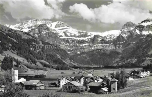 AK / Ansichtskarte Lenk Simmental BE Wildstrubel Raezligletscher Gletscherhorn Dorf Kirche Berge Tal