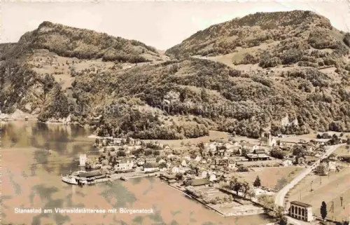 AK / Ansichtskarte Stansstad Nidwalden NW Vierwaldstaettersee Buergenstock Dorf Kirche Faehre Seeufer Berge Luftbild