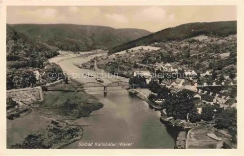 AK / Ansichtskarte Bad Karlshafen Bad Carlshafen Kassel Hessen Weser Bruecke Fluss Talblick Dampfer Ort Huegel