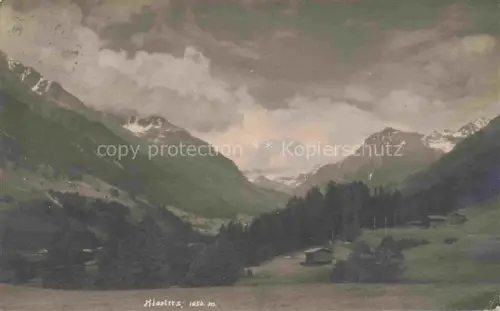 AK / Ansichtskarte Klosters-Serneus GR Tal Berge Wald Wiesen Huetten Praettigau Alpen Wolken