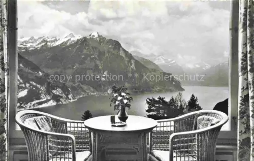 AK / Ansichtskarte Seelisberg UR Hotel-Bellevue Restaurationshalle Vierwaldstaettersee Berge Sessel Tisch Blumen Vorhaenge