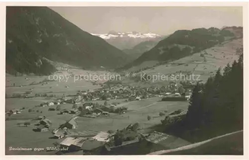 AK / Ansichtskarte Zweisimmen BE Wildstrubel Tal Bergpanorama Gletscher Dorf Wiesen Tannenwald