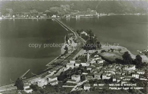 AK / Ansichtskarte Melide Lago di Lugano TI Bissone Ponte Lago-di-Lugano Damm Eisenbahn See Ortschaft Luftbild