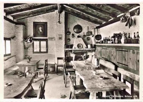 AK / Ansichtskarte Brione-Verzasca Minusio Locarno TI Grotto Cà-Nostra Restaurant Innenraum Kamin Holztische Gemaelde Kupfergeschirr