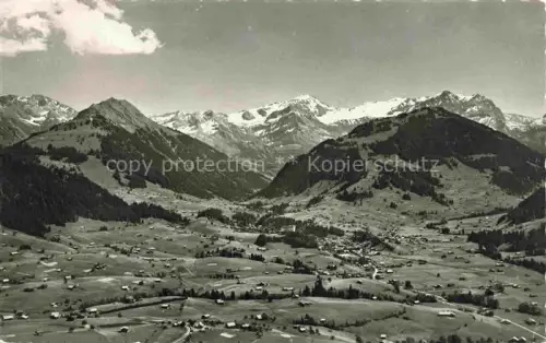 AK / Ansichtskarte Gstaad Saanen BE Wasserngrat Windspillen Bergpanorama Alpen Talblick Wiesen Weiler