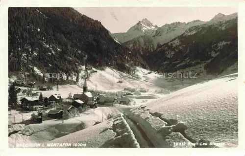 AK / Ansichtskarte Gaschurn Vorarlberg Winterlandschaft Dorf Kirche Schnee Berge Tal Montafon