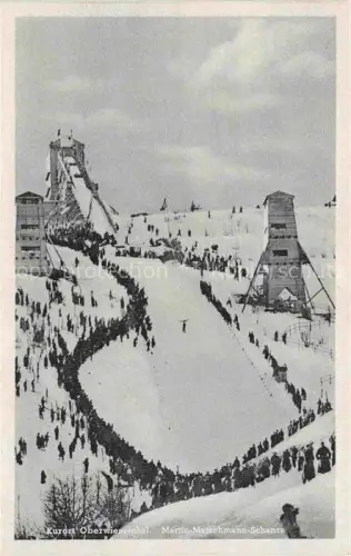 AK / Ansichtskarte Oberwiesenthal Erzgebirge Sachsen Martin-Mutschmann-Schanze Skisprungschanze Skispringen Zuschauer Winter Schnee Wintersport