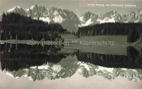 AK / Ansichtskarte Kitzbuehel Tirol AT Schwarzsee Wilder-Kaiser Berge Wald See Spiegelung Alpen