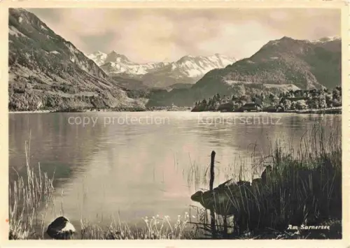 AK / Ansichtskarte Sarnen Obwalden OW Sarnersee Schwarzhorngruppe See Berge Schilf Spiegelung Bergpanorama