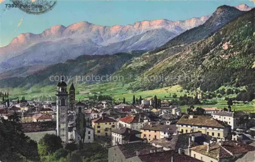 AK / Ansichtskarte Poschiavo GR Stadtpanorama Kirche Kirchturm Bergtal Alpenberge Daecher Wiesen Zypressen
