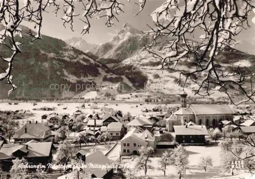 AK / Ansichtskarte Schruns Tschagguns Montafon Vorarlberg AT Montafon Mittagspitze Kirche Ortschaft Winterlandschaft Schnee Berge Wald