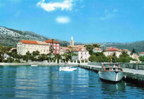 AK / Ansichtskarte Orebic Croatia Hafen Boote Motorboot Haeuser Kirche Berge Kueste