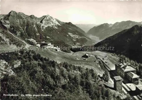 AK / Ansichtskarte Alp Gruem Bernina GR Poschiavo Bergstation Alpenlandschaft Gebirge Wald See Gleisanlage Fernblick