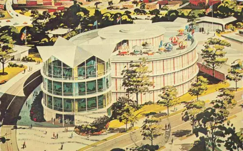 AK / Ansichtskarte NEW YORK City USA Pavilion-of-American-Interiors New-Yorks-Worlds-Fair Rundbau Glasfassade Vogelperspektive Flaggen Dachterrasse Sonnenschirme