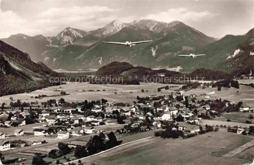 AK / Ansichtskarte Unterwoessen Bayern Segelflugzeuge Glider Alpental Kirche Bauernhaeuser Berge Chiemgau