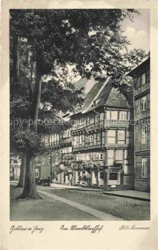 AK / Ansichtskarte GOSLAR Harz Niedersachsen Am-Marktkirchof Fachwerkhaus Restaurant Baeume Kopfsteinpflaster Strassenszene