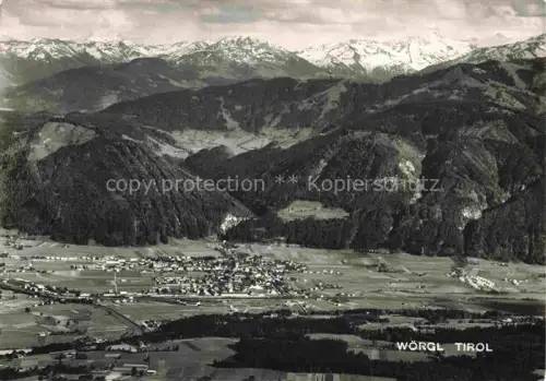 AK / Ansichtskarte Woergl  Leukental Kufstein Tirol AT Luftbild Stadtansicht Alpen Berge Schnee Tal Felder Wald